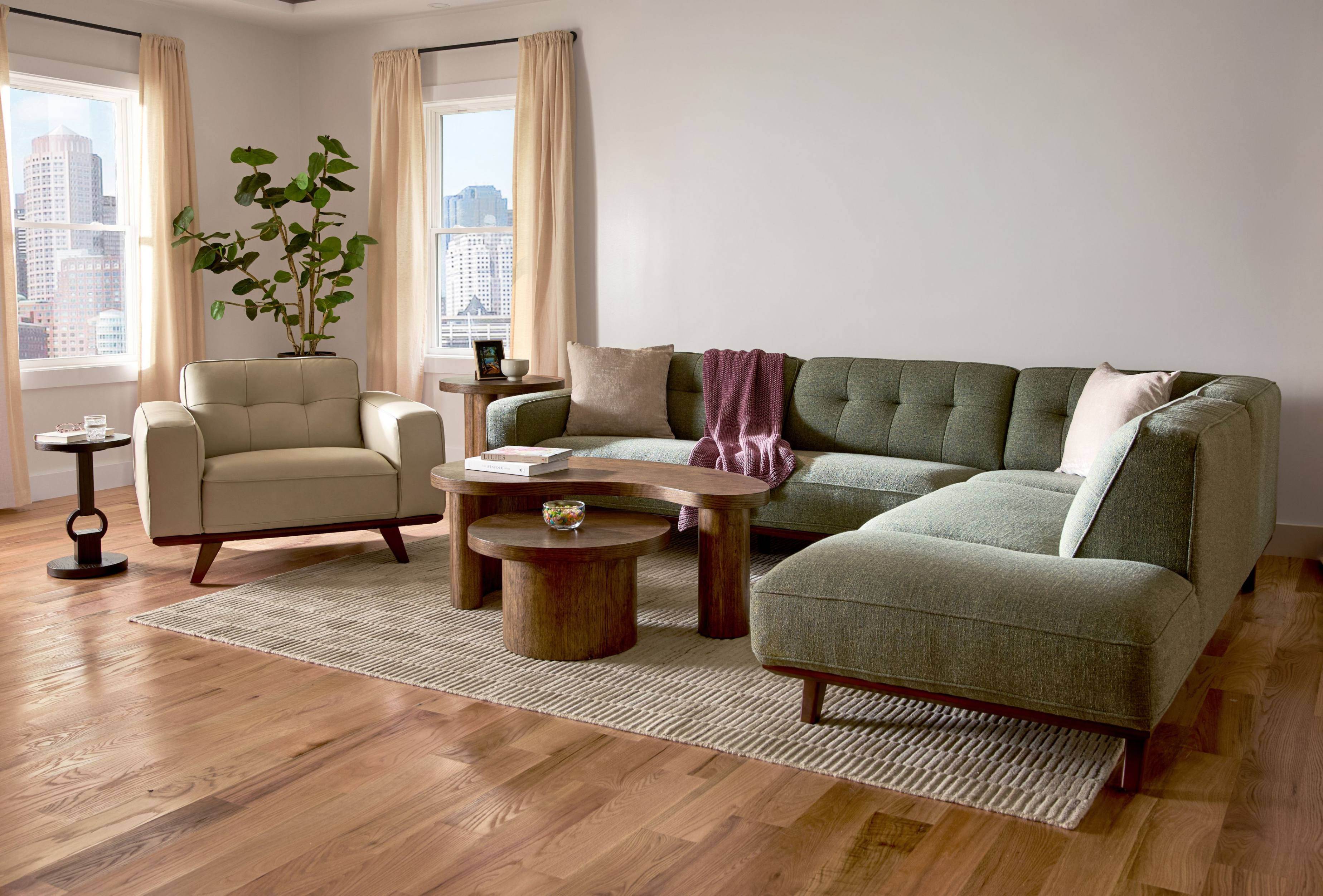 Green Sectional in a sunlit living room