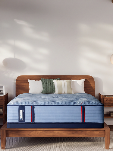Serta Perfect Dream Queen Mattress set in a well-lit bedroom.