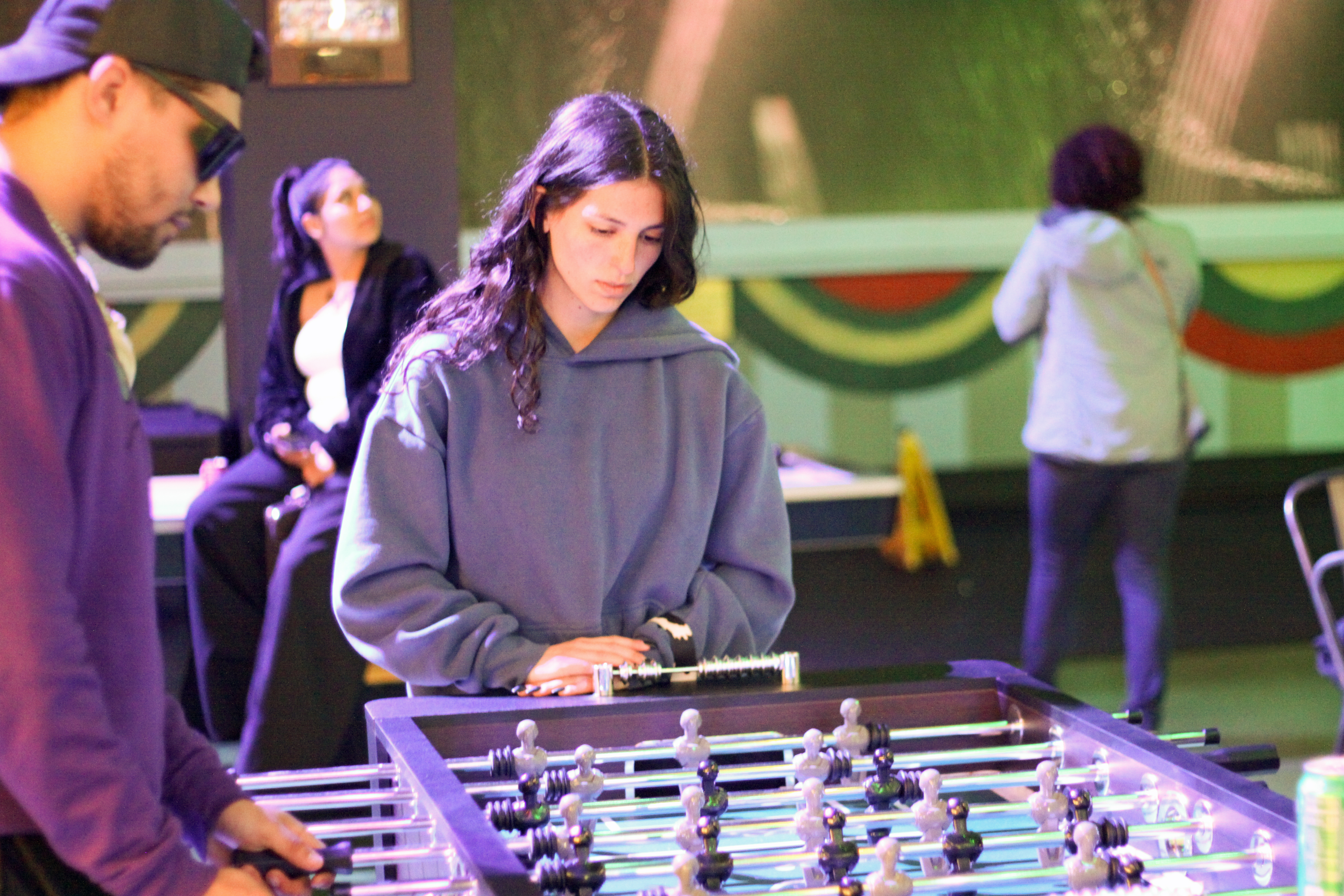 People playing foosball