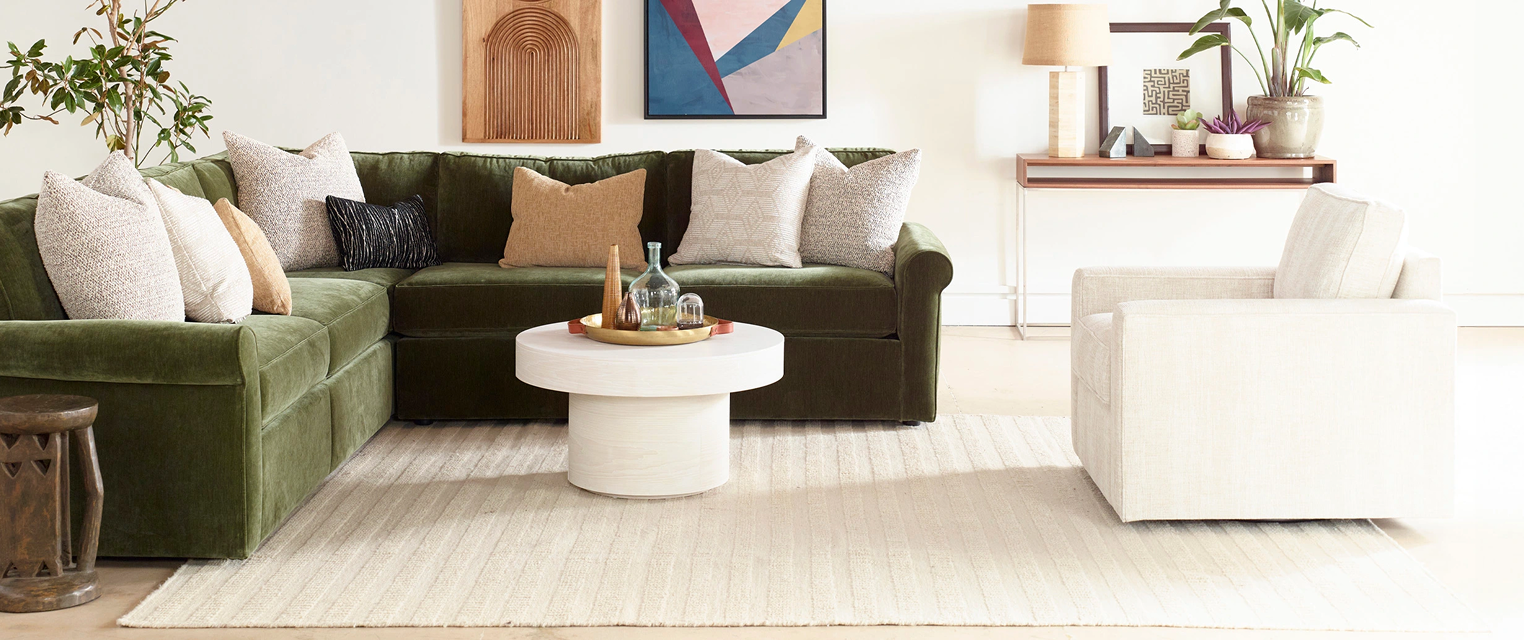 Styled living room with sectional sofa and accent chair
