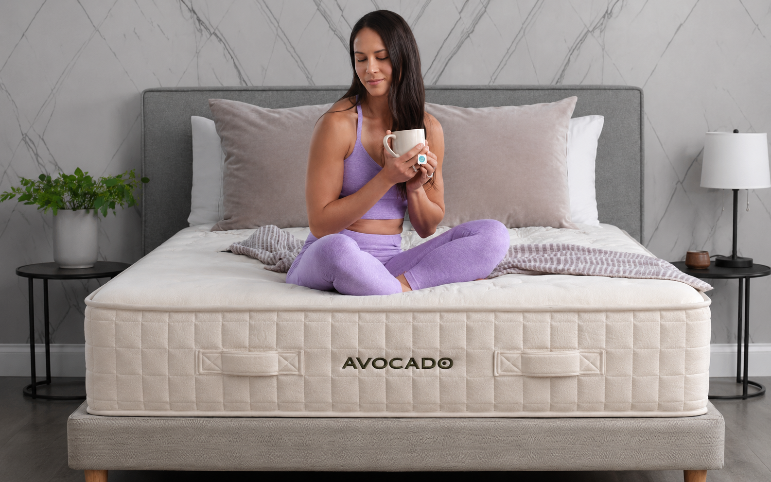 Woman laying on Avocado Plush Mattress